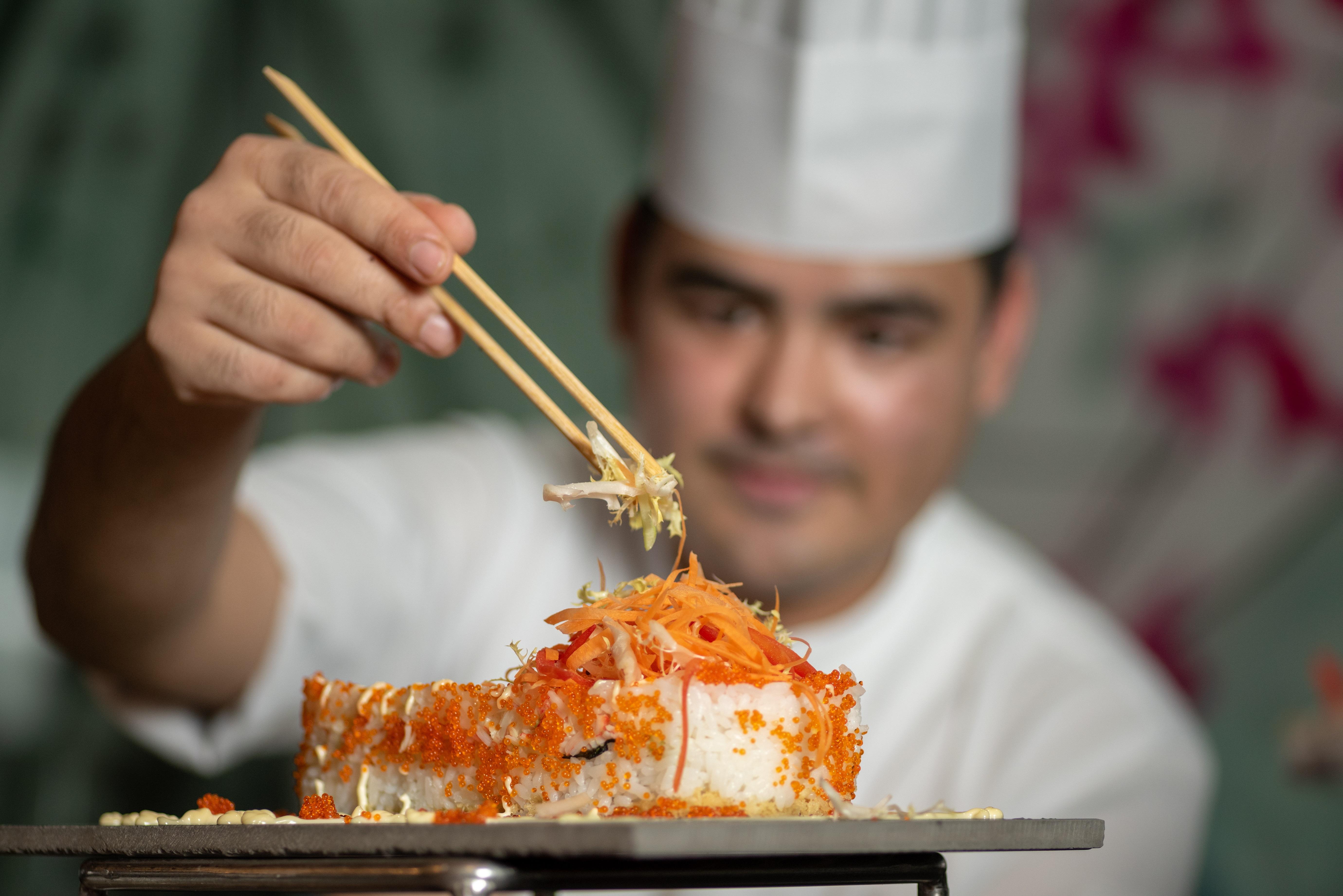 Vintage Grand Hotel - Formerly Ghaya Grand Hotel Dubai Exterior photo Chef preparing sushi